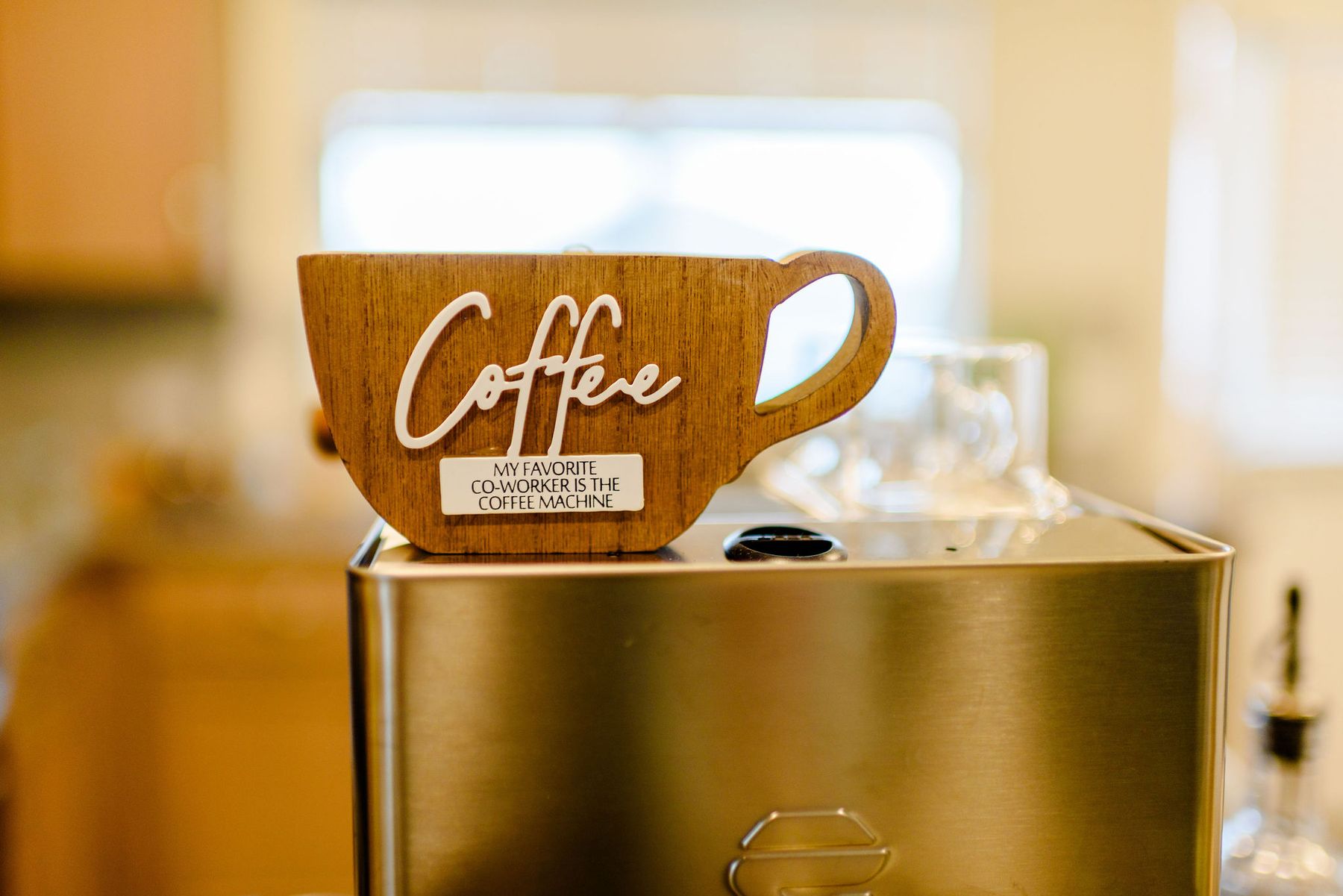 Coffee sign on top of the espresso machine